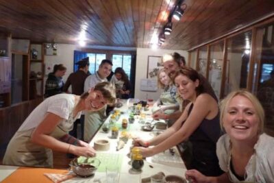 Cusco: Bean to bar chocolate workshop - The four steps: roasting, husk, metate grind, and melangeur refining