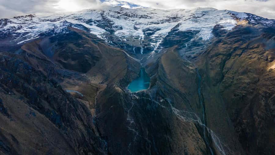Cusco: Rainbow Mountain and Humantay Lake 2-Day Tour + Meals - The stone-laying moment (and why your timing there matters)