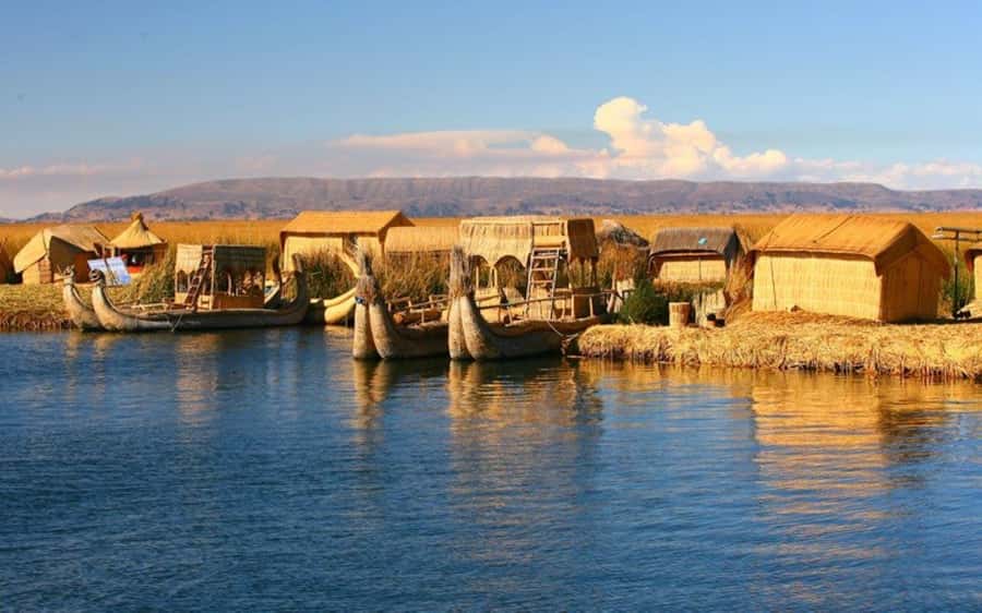 From Cusco: Lake Titicaca - Full-Day Tour - Arriving at the port and meeting the Uros families on totora