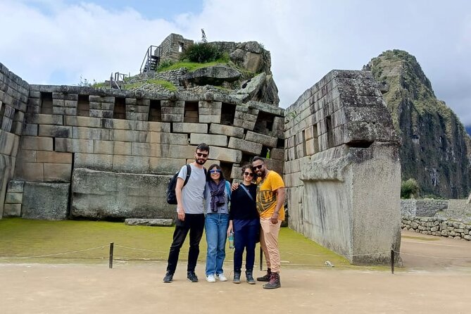 Machu Picchu Small Group Day Tour from Cusco - Heading back down: bus to Aguas Calientes, train to Ollantaytambo, Cusco transfer